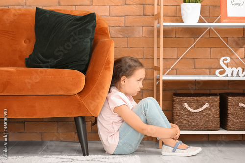 Sad little girl with autist...