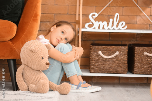 Sad little girl with autist...