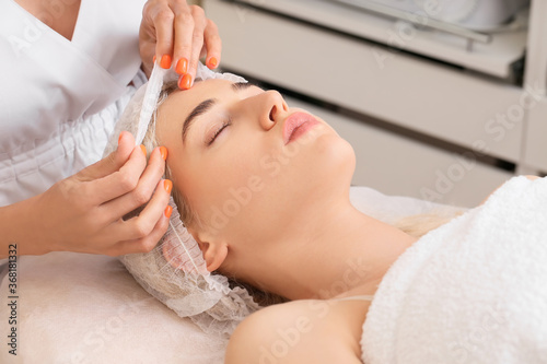 Woman undergoing cosmetic procedure in beauty salon © Pixel-Shot