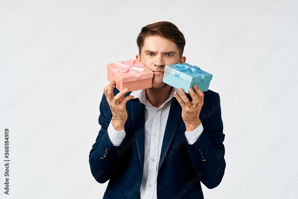 Man with gifts in hands celebration birthday official Man with gifts in hands celebration birthday official