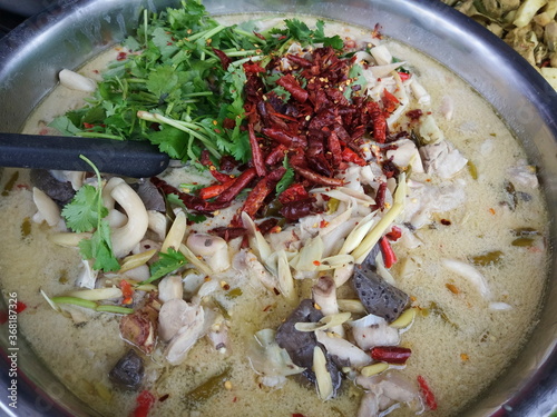 Top view of Thai traditional food Tom Kha Gai (Coconut Milk Soup With Chicken).