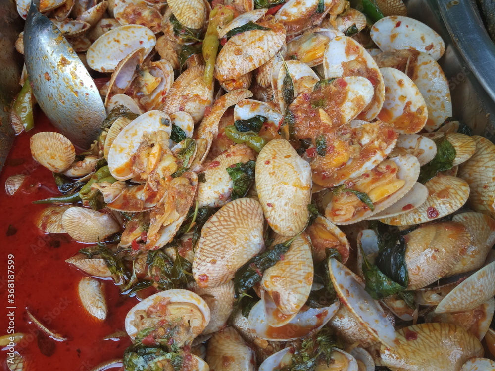 Top view of Thai traditional food Stir-Fried clams with Curry. Top view of Thai traditional food Stir-Fried clams with Curry.
