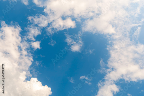 Fresh blue sky and soft white clouds, The idea for the feeling of fresh weather, Bright blue sky with fluffy white clouds, Clean on a hot summer day.