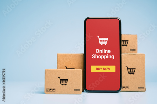 Concept online Sopping. boxes and shopping bag with Smartphone Online Shopping screen.