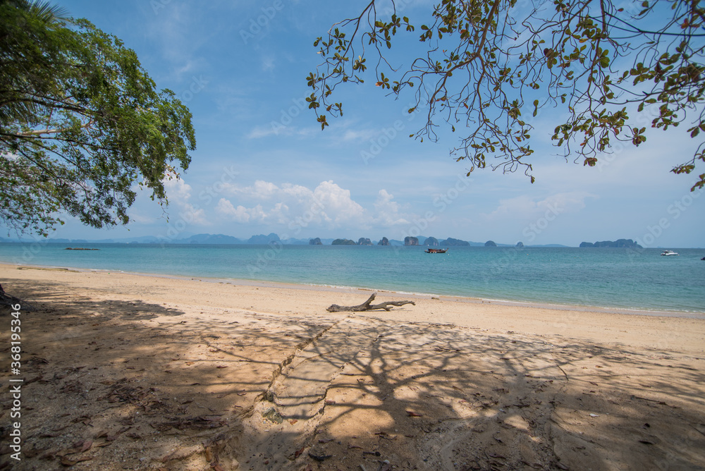 Beach scenery of relaxing beach.The summer vacation of your travel holiday.It's happy time running on the beach and beautiful clear sea water Beach scenery of relaxing beach.The summer vacation of your travel holiday.It's happy time running on the beach and beautiful clear sea water
