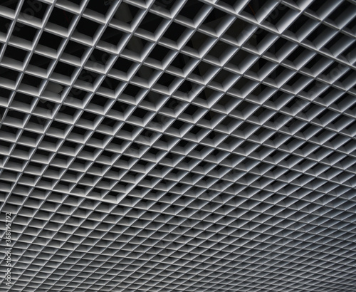 Grid structure of suspended ceiling in an mall building. Abstract modern architecture. 