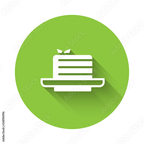 White Medovik icon isolated with long shadow. Honey layered cake or russian cake Medovik on plate. Green circle button. Vector.