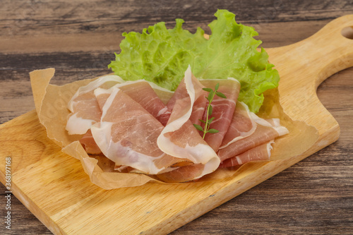 Italian prosciutto pork meat over board