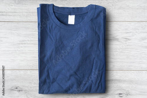 T-shirt on wooden background