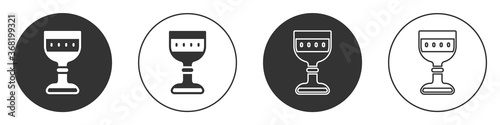 Black Medieval goblet icon isolated on white background. Circle button. Vector.