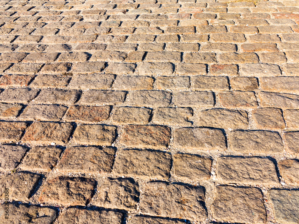 Urban stone paving stones. Texture, background, selective focus Urban stone paving stones. Texture, background, selective focus