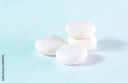 The white marshmallow is an isolated image, stacked together to use as a background image. Is snack food.