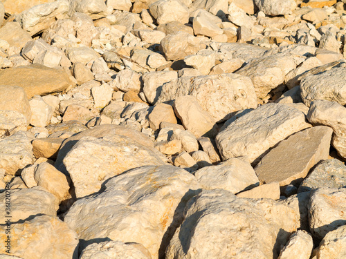 Large stones on the stone beach in the background