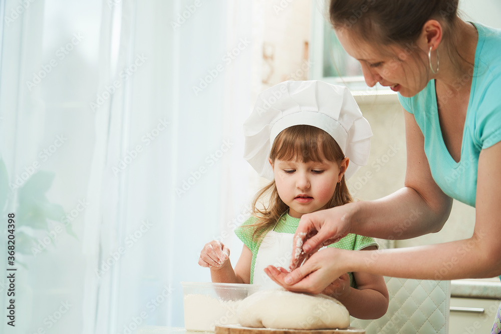 mother and child have fun together, prepare dough, bake cookies