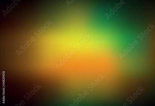 Dark Green, Yellow vector blurred shine abstract background.