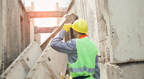 Construction worker with helmet in outdoors.