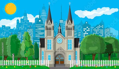 Exterior of catholic or protestant church cathedral in gothic style with fence and trees behind. Chapel. Tower with cross. Park with cityscape and sky. Suburb church concept. Flat vector illustration