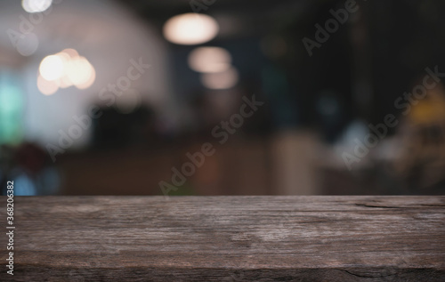 Wood Table Top in Blur Background room interior with empty copy space.