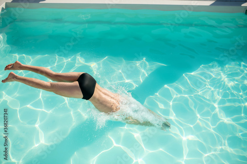 Entrance of the swimmers body into the water.