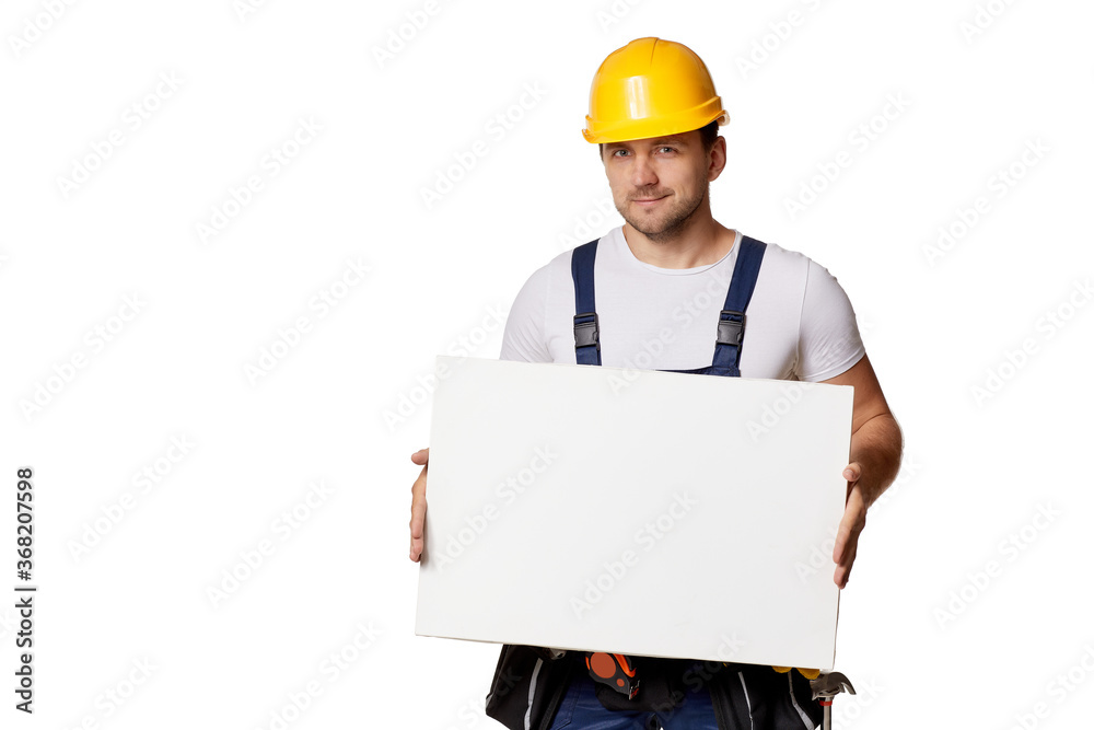 caucasian repairman worker in uniform and helmet holding empty blank board on white background caucasian repairman worker in uniform and helmet holding empty blank board on white background