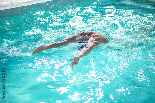 Swimmer underwater while swimming in the pool