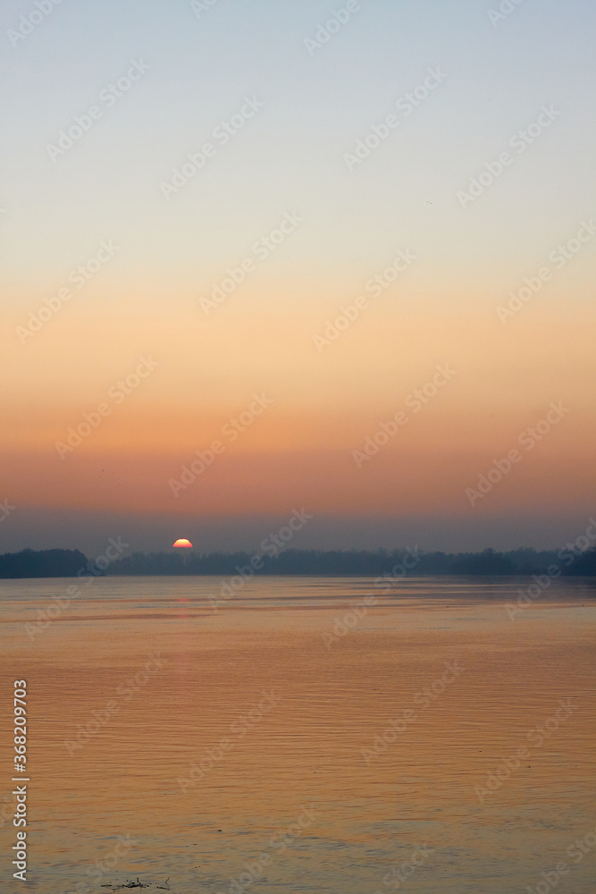 Orange Sunset over the Danube River in autumn