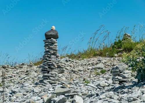 beautiful white stone piles by the sea, these objects were built by travelers, Saaremaa Island, Estonia photo