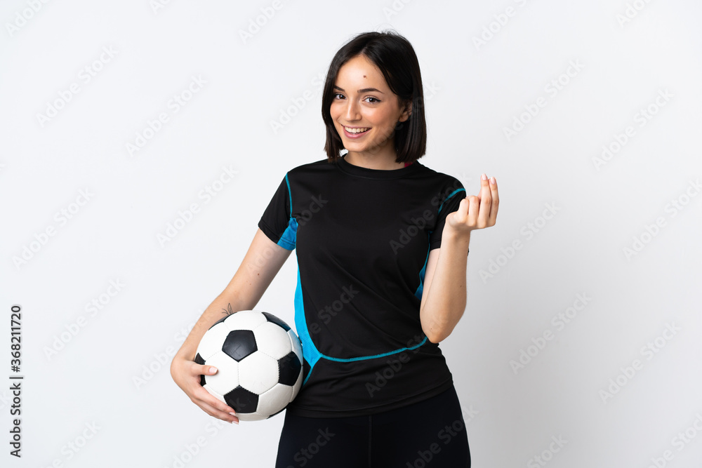 Young football player woman isolated on white background making money gesture Young football player woman isolated on white background making money gesture