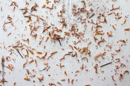 pieces of graphite among of sawdust  photo