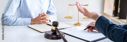Canvastavla Male lawyer and businesswoman working and discussion having at law firm in offic