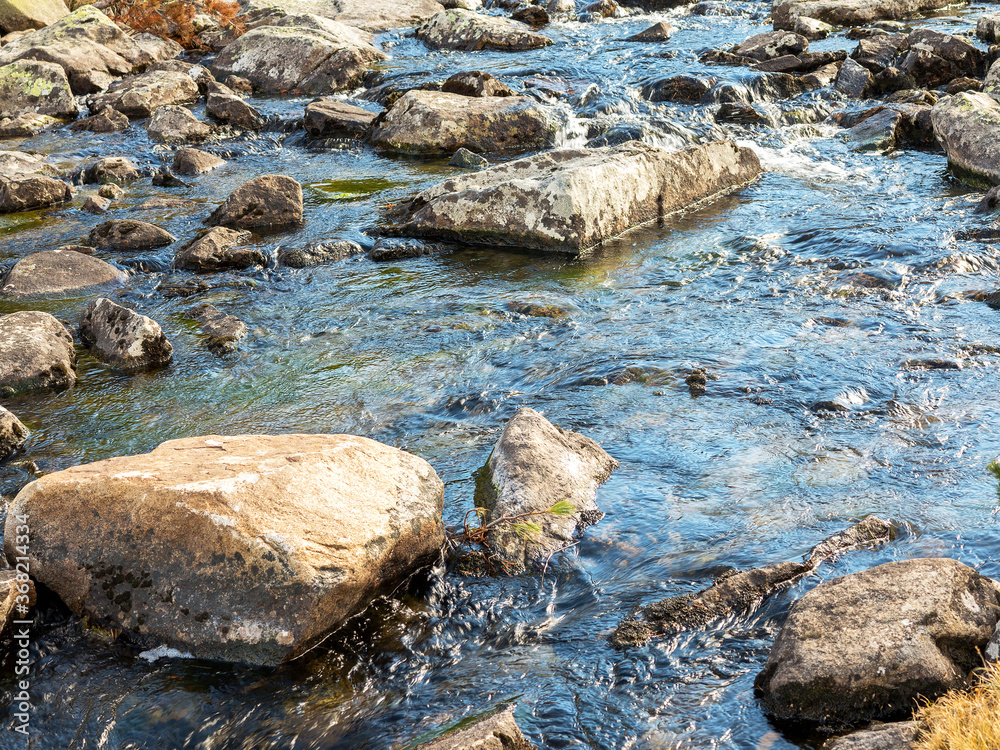 stones and mountain river with small waterfall, selective focus stones and mountain river with small waterfall, selective focus