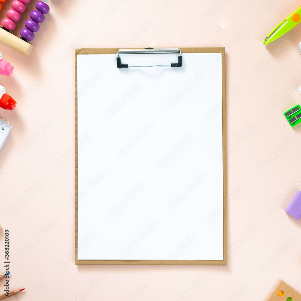 The tablet of paper and school supplies. back to school concept. Copy space, flat lay, top view, square The tablet of paper and school supplies. back to school concept. Copy space, flat lay, top view, square