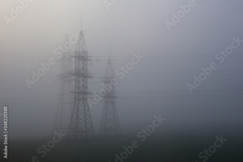 Support of high-voltage transmission lines in fog © lolya1988