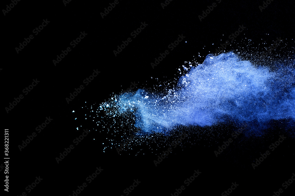 Obraz premium Closeup of blue dust particle splash isolated on black background.