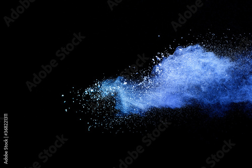 Fototapeta Naklejka Na Ścianę i Meble -  Closeup of blue dust particle splash isolated on black background.