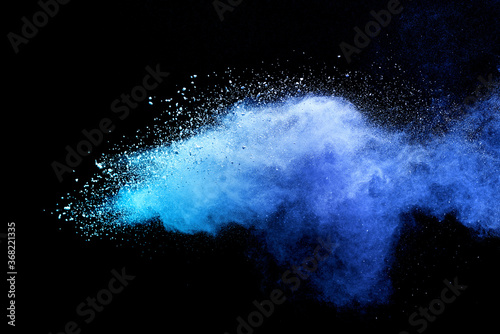 Closeup of blue dust particle splash isolated on black background.