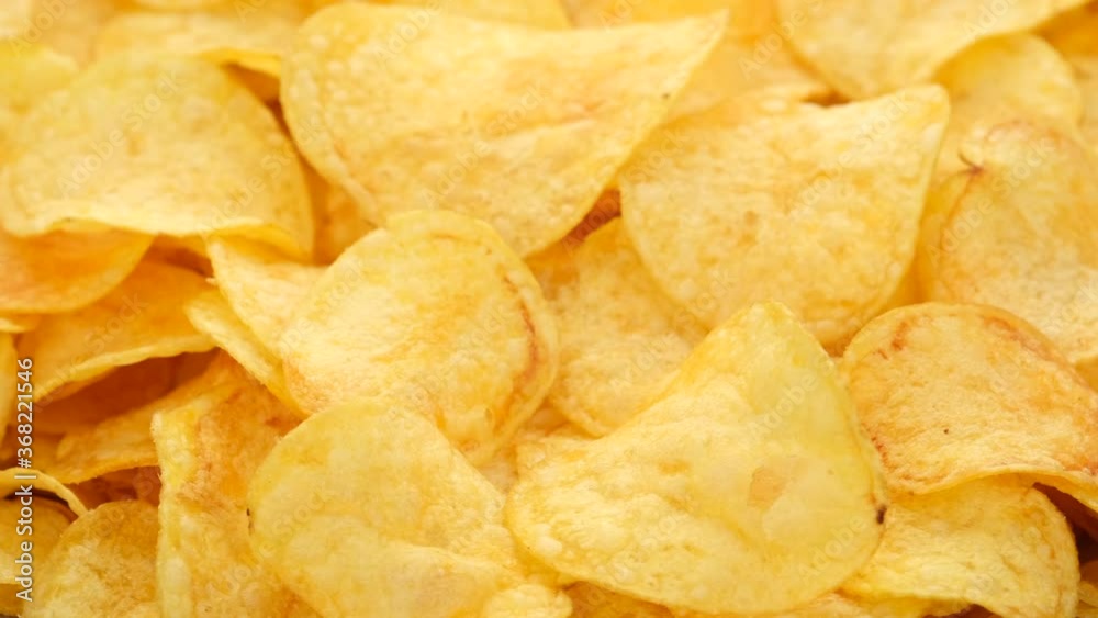 potato chips with cheddar cheese, rotating close up potato chips with cheddar cheese, rotating close up