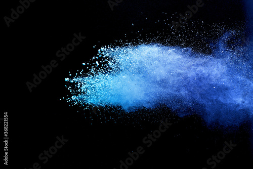 Closeup of blue dust particle splash isolated on black background.