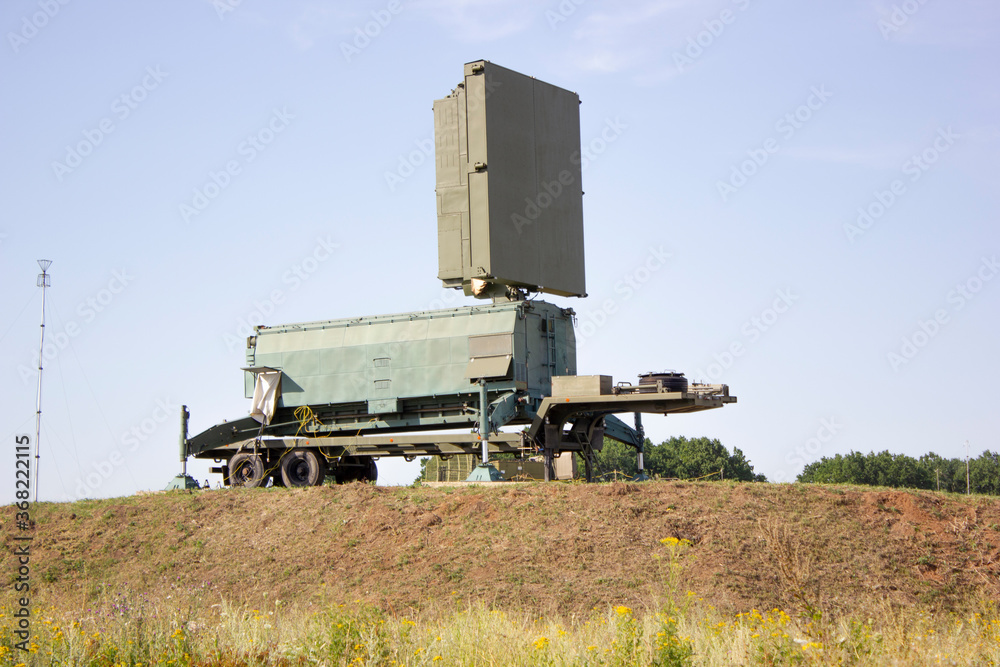 Military radar station element, which stands on a dais among the natural landscape Military radar station element, which stands on a dais among the natural landscape