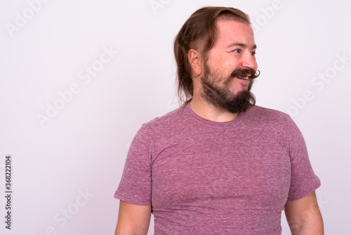 Portrait of happy bearded man with mustache and long hair