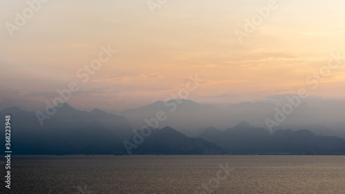 majestic mountains covered with clouds and fog