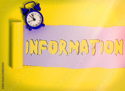 Word writing text Information. Business photo showcasing knowledge obtained from investigation, study, or instruction Rolled ripped torn cardboard placed above a wooden classic table backdrop photo