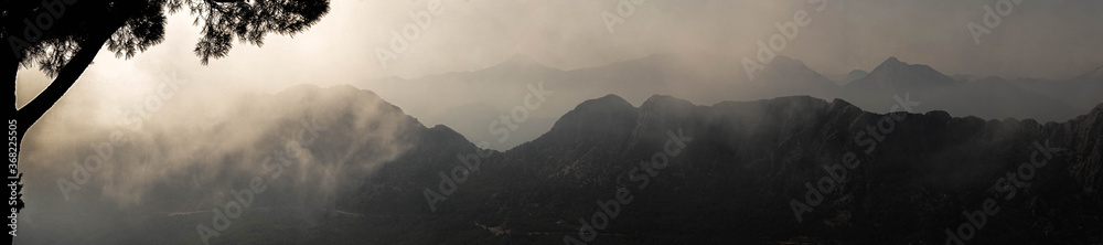 majestic mountains covered with clouds and fog