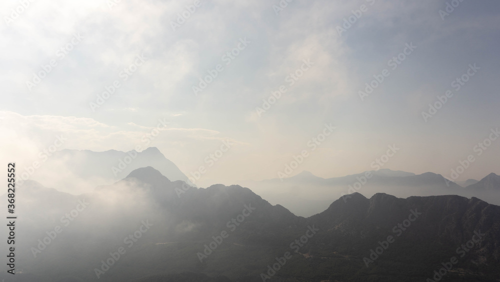 majestic mountains covered with clouds and fog