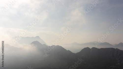 majestic mountains covered with clouds and fog © Olexandr