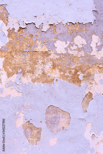 Vertical photo of wall shabby from old pink pastel paint. Grungy background