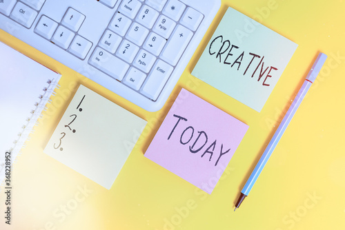 Conceptual hand writing showing Creative. Concept meaning managed to get around legal or conventional limits of laws Empty papers with copy space on yellow background table photo