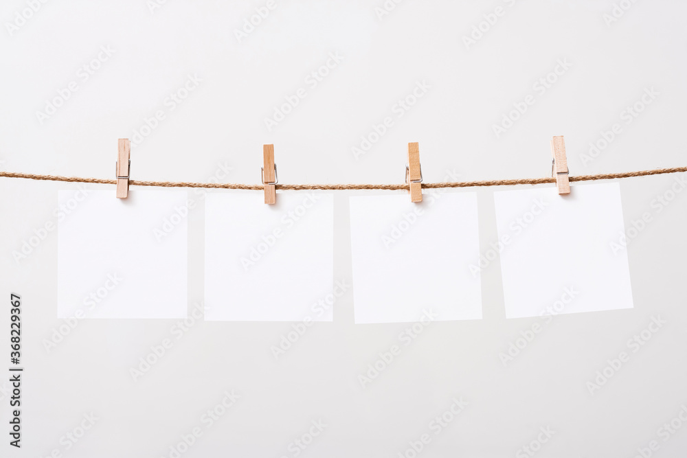 paper cards hanging rope isolated on white background
paper cards hanging rope isolated on white background