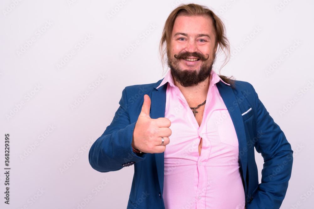 Portrait of happy bearded businessman with mustache and long hair Portrait of happy bearded businessman with mustache and long hair