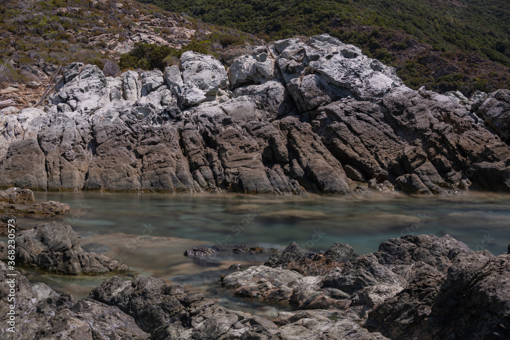 Long exposure of the sea and rocks on the coast of the Mediterranean Island of Corsica.  Nonza.
